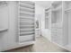 Walk-in closet with custom built-in shelving and drawers, offering ample storage space at 878 Middle Fork Trl, Suwanee, GA 30024