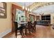 Inviting dining area with wood floors and stone archways at 878 Middle Fork Trl, Suwanee, GA 30024