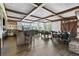 Elegant dining room with a bar, dark wood floors, a fireplace, and ample seating for gatherings at 878 Middle Fork Trl, Suwanee, GA 30024