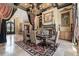 Formal dining room with a fireplace, decorative rug, and detailed window treatments at 878 Middle Fork Trl, Suwanee, GA 30024