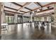 Large event space featuring wood floors, tables and chairs and floor to ceiling windows providing lots of light at 878 Middle Fork Trl, Suwanee, GA 30024