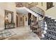 Stunning foyer featuring a grand staircase, elegant chandelier, and decorative accents at 878 Middle Fork Trl, Suwanee, GA 30024