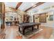 Entertain in style with this game room with a pool table, stone accents, and bar area at 878 Middle Fork Trl, Suwanee, GA 30024