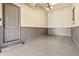 A clean and organized garage with epoxy flooring and a modern door at 878 Middle Fork Trl, Suwanee, GA 30024