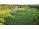 Scenic aerial view of a sprawling golf course with well-maintained fairways and greens at 878 Middle Fork Trl, Suwanee, GA 30024