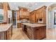 Gourmet kitchen featuring custom cabinetry, stone countertops, and large island at 878 Middle Fork Trl, Suwanee, GA 30024