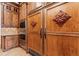 Elaborate custom cabinetry with built-in appliances and decorative carvings at 878 Middle Fork Trl, Suwanee, GA 30024