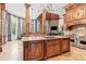 Stunning kitchen island with stone countertops and custom wood cabinetry at 878 Middle Fork Trl, Suwanee, GA 30024