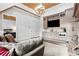 Bright living room boasts a stone fireplace, hardwood floors, built-in cabinets, and wet bar at 878 Middle Fork Trl, Suwanee, GA 30024
