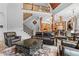 Inviting living room with high ceilings, flowing into a modern kitchen and dining area, ideal for entertaining at 878 Middle Fork Trl, Suwanee, GA 30024
