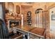 Home office featuring custom wood paneling, fireplace, and built-in bookshelves at 878 Middle Fork Trl, Suwanee, GA 30024