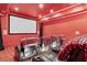 A cozy home theater with reclining seats and a large screen for immersive entertainment at 878 Middle Fork Trl, Suwanee, GA 30024