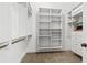 Spacious walk-in closet with adjustable shelving and drawers for ample storage and organization at 878 Middle Fork Trl, Suwanee, GA 30024
