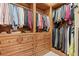 A custom closet with built-in shelving and drawers for maximum storage at 878 Middle Fork Trl, Suwanee, GA 30024