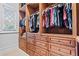 Custom walk-in closet with ample storage and natural light at 878 Middle Fork Trl, Suwanee, GA 30024