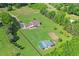 Spacious property featuring a well-maintained home, sprawling lawns, outbuildings and surrounded by trees at 24 Fossetts Nw Cv, Cartersville, GA 30121