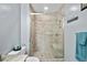 Modern bathroom with a sleek glass shower enclosure featuring stylish tile and built-in seat, along with a toilet at 24 Fossetts Nw Cv, Cartersville, GA 30121