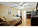 Primary bedroom with hardwood floors, ensuite bath and walk-in closet at 24 Fossetts Nw Cv, Cartersville, GA 30121