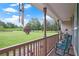 Cozy porch featuring a rocking chair and scenic views of the well-manicured front yard at 24 Fossetts Nw Cv, Cartersville, GA 30121