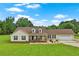 Charming ranch-style home featuring a welcoming front porch and an attached two-car garage with a well-manicured front lawn at 24 Fossetts Nw Cv, Cartersville, GA 30121