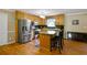 Well-appointed kitchen with stainless steel appliances, wooden cabinets, and a granite countertop island at 24 Fossetts Nw Cv, Cartersville, GA 30121
