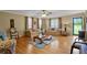 Spacious living room featuring hardwood floors, a ceiling fan, and comfortable seating at 24 Fossetts Nw Cv, Cartersville, GA 30121