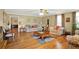 Bright living room with wood floors, neutral walls, and large windows creating a cozy space at 24 Fossetts Nw Cv, Cartersville, GA 30121