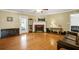 Spacious living room featuring fireplace, hardwood floors and back patio door at 24 Fossetts Nw Cv, Cartersville, GA 30121