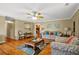 Comfortable living room with lots of seating, wood floors, and lots of space for entertaining at 24 Fossetts Nw Cv, Cartersville, GA 30121