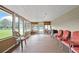 Spacious screened-in porch with seating, perfect for enjoying the outdoors at 24 Fossetts Nw Cv, Cartersville, GA 30121