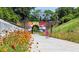 Scenic bike path and tunnel with art, surrounded by wildflowers and lush greenery at 2733 Creek View Nw Ter, Atlanta, GA 30318