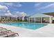 Inviting community pool with a covered pavilion and comfortable lounge chairs on a sunny day at 2733 Creek View Nw Ter, Atlanta, GA 30318