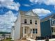 Charming two-story home featuring brick facade and covered front porch under a blue and cloudy sky at 2733 Creek View Nw Ter, Atlanta, GA 30318