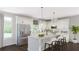 Bright kitchen features stainless steel appliances, white cabinets, and spacious island with seating at 2733 Creek View Nw Ter, Atlanta, GA 30318