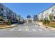 Street view showcases the townhome community with a gated entrance and well-manicured lawns at 2733 Creek View Nw Ter, Atlanta, GA 30318