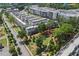 A captivating aerial view showcases modern townhomes, lush green spaces, and the overall community layout at 1030 Burnside Nw Pl, Atlanta, GA 30318