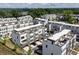 A high-angle shows roof tops and patios of townhomes in a neatly planned community at 1030 Burnside Nw Pl, Atlanta, GA 30318