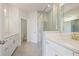 Modern bathroom featuring double vanities, sleek fixtures, and a luxurious glass-enclosed shower at 1030 Burnside Nw Pl, Atlanta, GA 30318