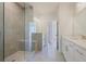Elegant bathroom featuring a glass shower, tiled walls, and double vanities at 1030 Burnside Nw Pl, Atlanta, GA 30318