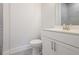 Bathroom features white vanity with a gray tiled walk-in shower at 1030 Burnside Nw Pl, Atlanta, GA 30318
