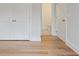 Bedroom view showcases hardwood floors, a closet and a door to the en suite at 1030 Burnside Nw Pl, Atlanta, GA 30318