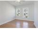 Cozy bedroom with hardwood floors and natural light from the windows at 1030 Burnside Nw Pl, Atlanta, GA 30318