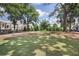 Large community greenspace with mature trees and a grassy lawn at 1030 Burnside Nw Pl, Atlanta, GA 30318