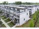 Exterior aerial view of new construction townhomes featuring a tree lined street at 1030 Burnside Nw Pl, Atlanta, GA 30318
