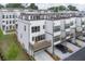 Aerial view of an end unit townhome with ground level garage parking at 1030 Burnside Nw Pl, Atlanta, GA 30318