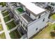Aerial view of townhomes featuring rooftop decks and landscaping at 1030 Burnside Nw Pl, Atlanta, GA 30318
