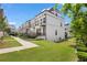 Townhome exterior view with manicured lawn and sidewalks, offering a contemporary aesthetic at 1030 Burnside Nw Pl, Atlanta, GA 30318