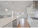 Gourmet kitchen with white cabinets, granite countertops, and stainless-steel appliances at 1030 Burnside Nw Pl, Atlanta, GA 30318