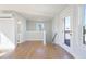 Open-concept living room with hardwood floors, bright walls, and access to outdoor deck at 1030 Burnside Nw Pl, Atlanta, GA 30318