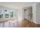 Bright living room featuring hardwood floors, recessed lighting, and large windows with access to a deck at 1030 Burnside Nw Pl, Atlanta, GA 30318